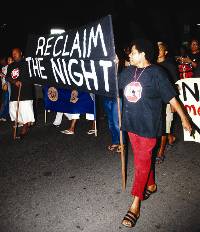 Women march through the streets of Suva last night.