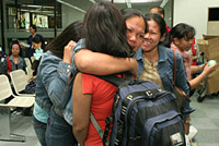 Filipino migrant workers are reunited with their families following conflict in Lebanon in 2006.  IOM Photo/Angelo Jacinto
