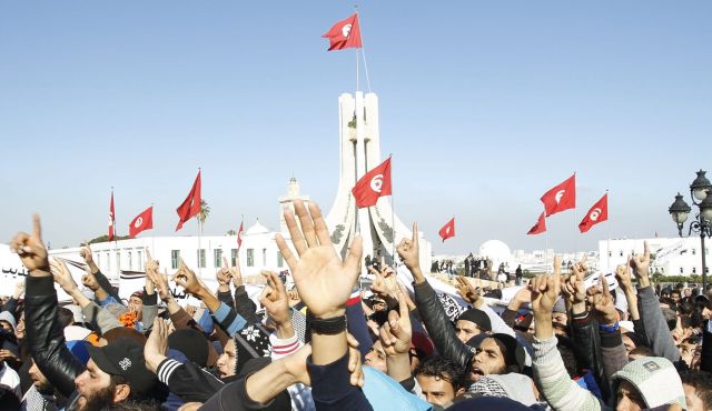 Tunisian Islamist movement members participate in a rally in Tunis December 17, 2013