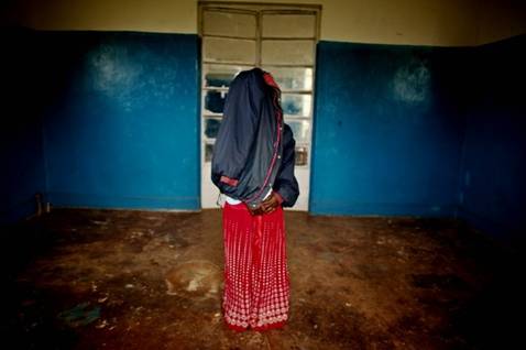 A victim of a mass rape campaign in the DR Congo in 2011 . Her identity has been concealed for security reasons and because rape carries strong stigma.