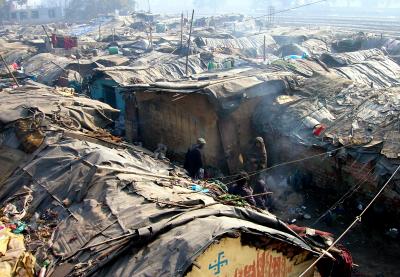 Slum houses are made out of discarded materials such as plastic, gunny bags and old pieces of cloth - 