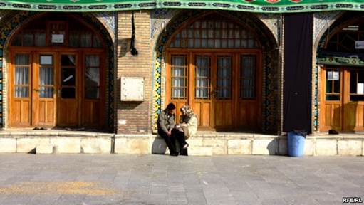 Two young people chat outside the Imamzade Ismayil Mausoleum in Qazvin, Iran. (file photo)